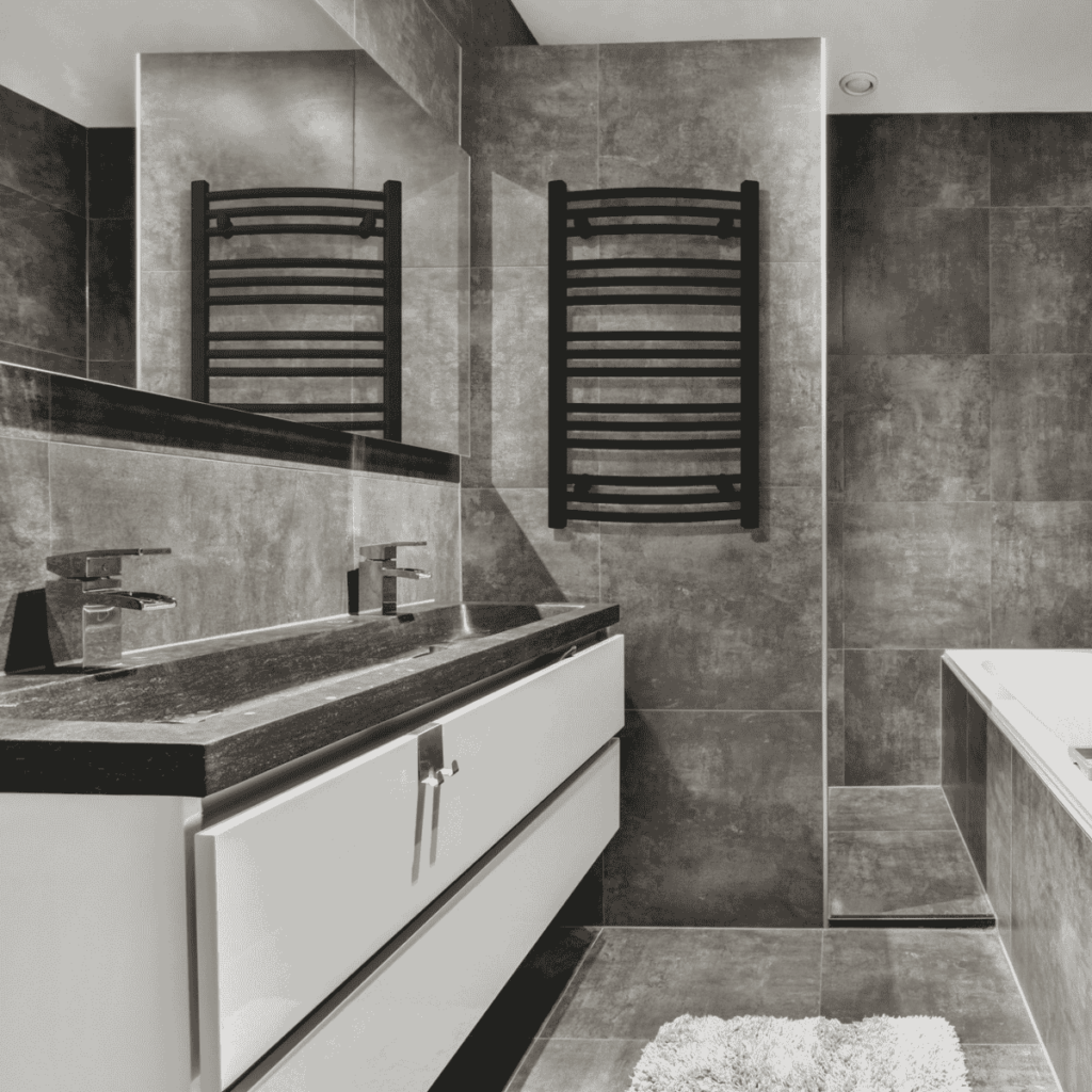 Grzejnik ENIX DT w kolorze czarnym w nowoczesnej łazience